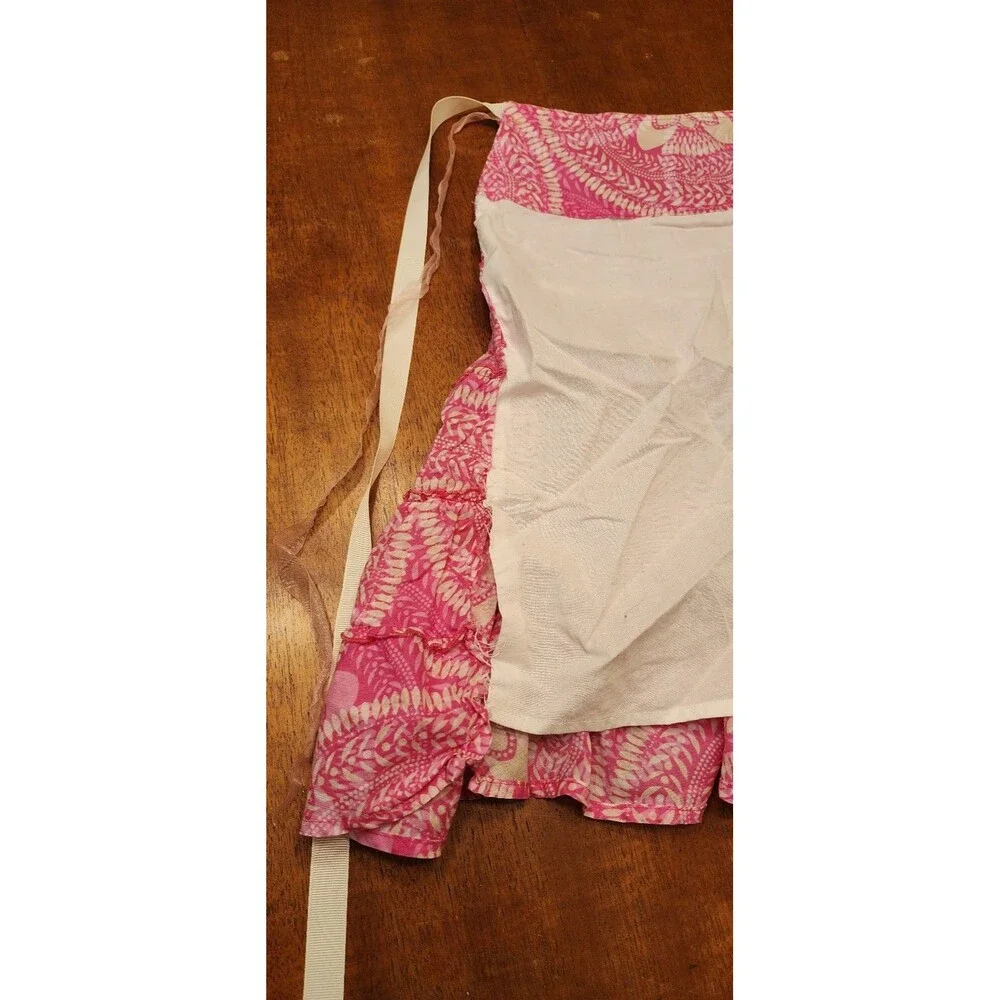 Vintage pink and white ruffled apron read and see